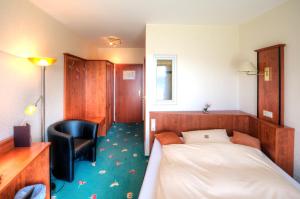 Postel nebo postele na pokoji v ubytování Hotel Freihof