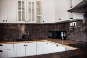 Kuchyň nebo kuchyňský kout v ubytování Apartmány na náměstí