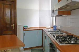 a kitchen with a sink and a stove top oven at IRMA Colua Manarola in Manarola