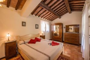 Postel nebo postele na pokoji v ubytování Agriturismo CaseGraziani