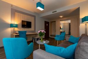 TV a/nebo společenská místnost v ubytování Hotel Regnum Residence