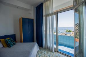 a hotel room with a view of the ocean at Residence Hotel Panoramic in Maiori