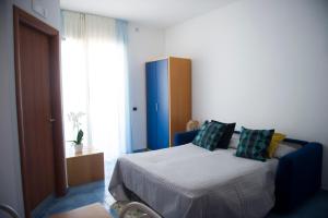 a bedroom with a bed with pillows on it at Residence Panoramic in Maiori