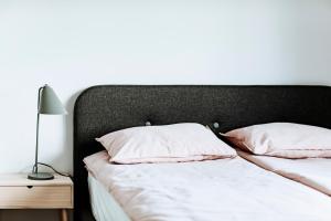 Posteľ alebo postele v izbe v ubytovaní Gdynia Square Apartment