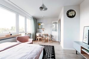 Posteľ alebo postele v izbe v ubytovaní Gdynia Square Apartment