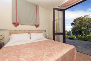 מיטה או מיטות בחדר ב-Villa Toscana