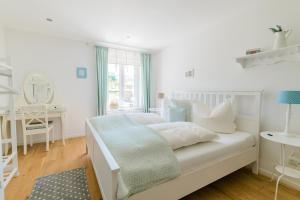 Ein Bett oder Betten in einem Zimmer der Unterkunft Belle Maison - Das kleine Hotel