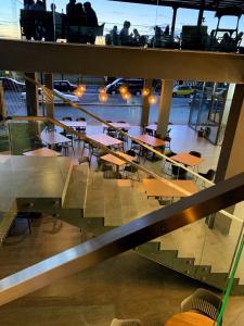 a dining room on a ship with tables and chairs at Sezon in Svityazʼ