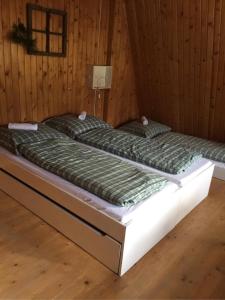 Postel nebo postele na pokoji v ubytování DomPodNiebem