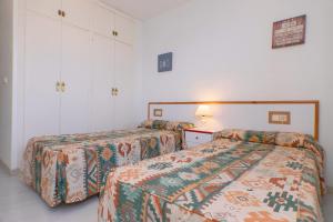 Ein Bett oder Betten in einem Zimmer der Unterkunft Torre Riviera