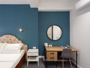 Posteľ alebo postele v izbe v ubytovaní Hotel Bohemian Garni - Skadarlija