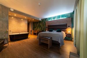 Postel nebo postele na pokoji v ubytování Hotel Kriunes