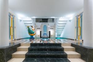 a staircase in a building with a peacock on the wall at Villa La Ventana in Sant'Agnello +142 photos
