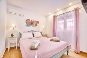 Postel nebo postele na pokoji v ubytování Corali House + 52 fotografií