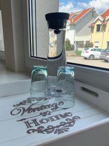 a glass vase sitting on a window sill at LieblingsOrt in Neusiedl am See