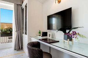 TV o dispositivi per l'intrattenimento presso Palazzo del Corso – Boutique Hotel