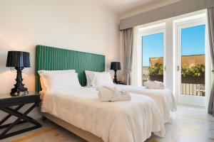 Letto o letti in una camera di Palazzo del Corso – Boutique Hotel