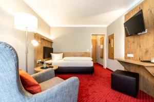 Postel nebo postele na pokoji v ubytování Hotel Vollmann + 36 fotografií