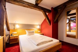 Postel nebo postele na pokoji v ubytování Hotel Vollmann