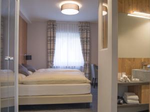 Postel nebo postele na pokoji v ubytování Hotel La Romantica