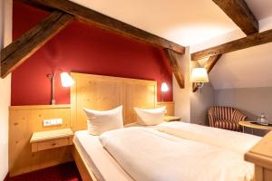 Postel nebo postele na pokoji v ubytování Hotel Vollmann