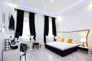 Voodi või voodid majutusasutuse Escape Luxury Suite - CA Domus Collection toas