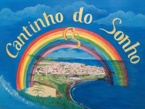a painting of a rainbow and the words columbina do condos at Cantinho do Sonho in Maia