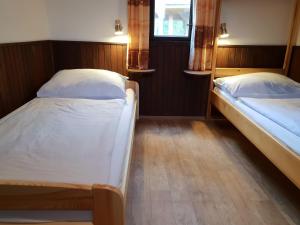 Postel nebo postele na pokoji v ubytování Chaty U Skály Kytlice