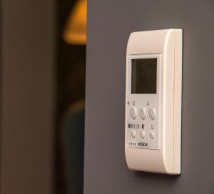 a white remote control is attached to a wall at HOTEL JAVIER MONTERO in Ribadeo