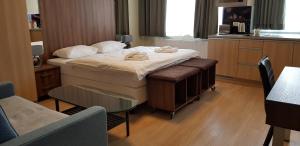 Posteľ alebo postele v izbe v ubytovaní Metropolis Apartamenty Centrum