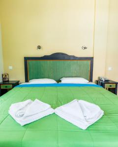 Postel nebo postele na pokoji v ubytování Aktaion Hotel