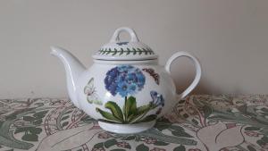 a tea pot sitting on top of a table at Sea Birds Cottage in Victoria