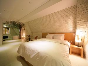 Krevet ili kreveti u jedinici u objektu Sinchon Hotel GAEUL