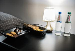 a table with a tray of food and a bottle of milk at DarkHouse in Łódź