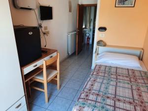 Postel nebo postele na pokoji v ubytování Hotel Vittoria