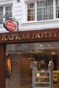 a sign for a katzas hotel in front of a store at Kafkas Hotel Istanbul in Istanbul