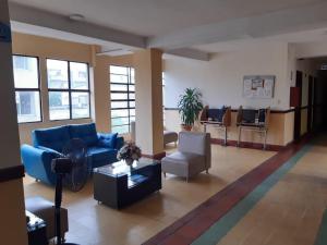 Ein Sitzbereich in der Unterkunft Hotel El Andino