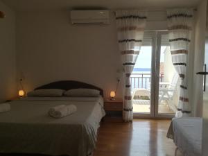 Posteľ alebo postele v izbe v ubytovaní Apartman Lidija Čiovo