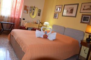 Postel nebo postele na pokoji v ubytování B&B Villa Olmo