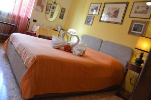 Postel nebo postele na pokoji v ubytování B&B Villa Olmo