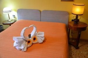Postel nebo postele na pokoji v ubytování B&B Villa Olmo