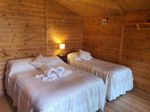 A bed or beds in a room at Stansted Airport Cottage 