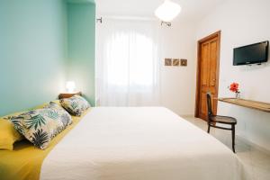 Ένα ή περισσότερα κρεβάτια σε δωμάτιο στο B&B Sa Cruxitta
