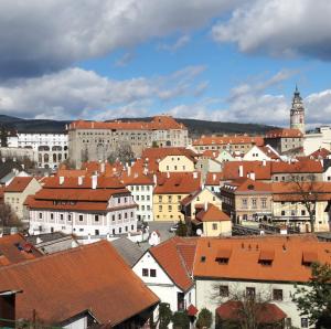 a view of a city with buildings and roofs at Hotel Garni Villa Areka in Český Krumlov