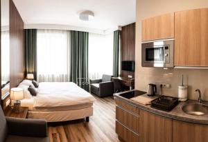 Kuchyňa alebo kuchynka v ubytovaní Metropolis Apartamenty Centrum
