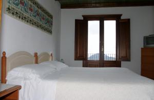 Cama o camas de una habitación en Le Roverelle