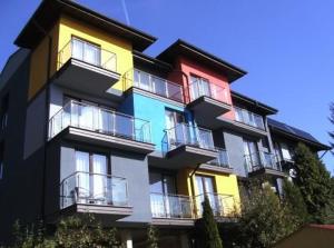 a multicolored building with a lot of windows at Pensjonat Bajkowy in Busko-Zdrój