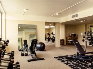 a gym with a lot of exercise equipment and a mirror at Hotel June West LA, a Member of Design Hotels in Los Angeles +98 photos