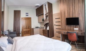 Posteľ alebo postele v izbe v ubytovaní Metropolis Apartamenty Centrum
