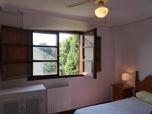 Posteľ alebo postele v izbe v ubytovaní Apartamento Ruiloba